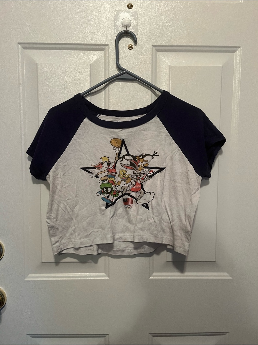 Freeze White Crop Raglan Tee with Navy Sleeves and Cartoon Graphic